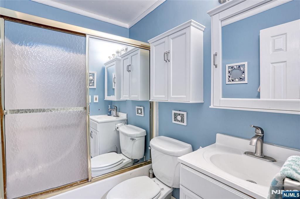 2009 Hawthorne Lane Mahwah, NJ 07430 - Photo 20 of 31 a bathroom with a toilet a sink and a mirror