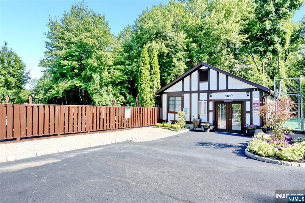 2009 Hawthorne Lane Mahwah, NJ 07430 - Photo 29 of 31 a front view of a house with a yard and potted plants