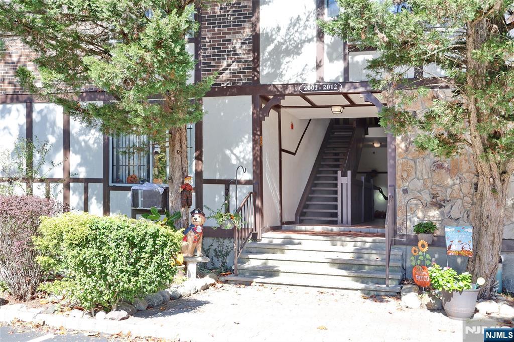 2009 Hawthorne Lane Mahwah, NJ 07430 - Photo 3 of 31 a view of a house with fountain and potted plants