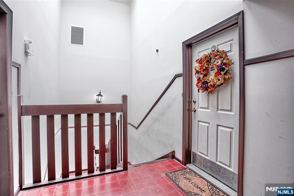 2009 Hawthorne Lane Mahwah, NJ 07430 - Photo 4 of 31 a view of a hallway with wooden floor and stairs