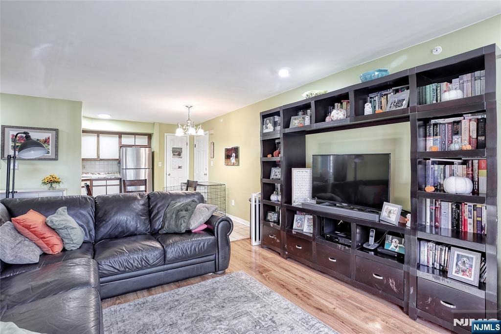 2009 Hawthorne Lane Mahwah, NJ 07430 - Photo 7 of 31 a living room with furniture and a flat screen tv