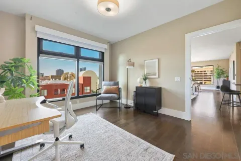 a living room with furniture and a large window