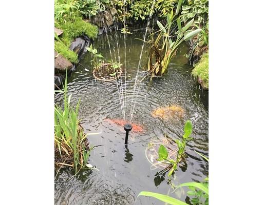 7 13th Avenue Wareham, MA 02571 - Photo 20 of 22 a vase of flowers sitting on a floor