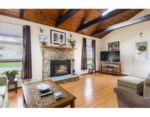 7 13th Avenue Wareham, MA 02571 - Photo 3 of 22 a living room with furniture a flat screen tv and a fireplace