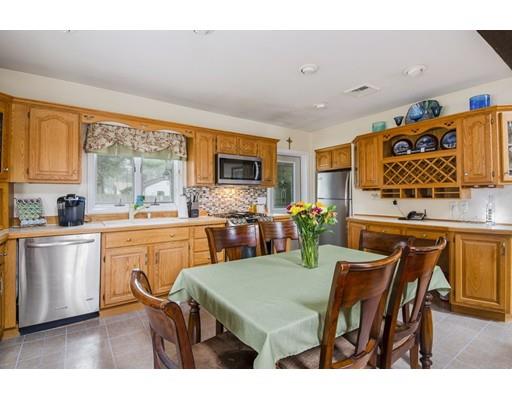 7 13th Avenue Wareham, MA 02571 - Photo 8 of 22 a open dining room with stainless steel appliances kitchen island granite countertop furniture and a large window