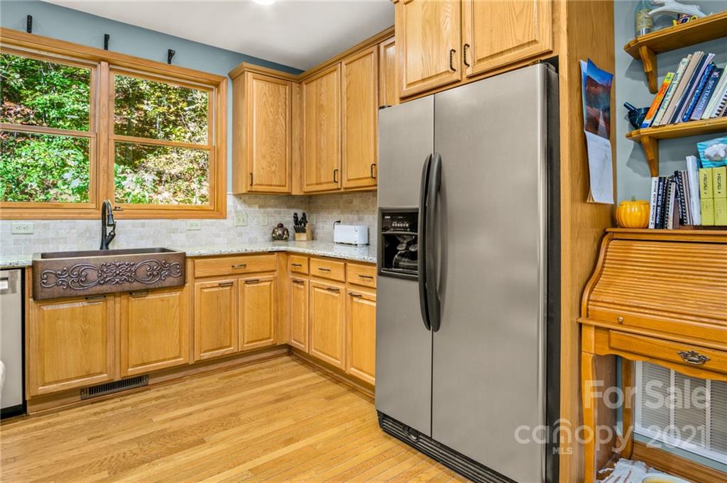 74 Apgar Road Candler, NC 28715 - Photo 11 of 46 a kitchen with stainless steel appliances granite countertop a refrigerator and a sink