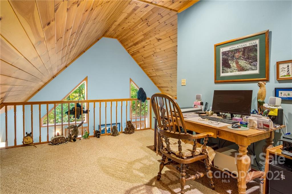 74 Apgar Road Candler, NC 28715 - Photo 16 of 46 a workspace with furniture and rug