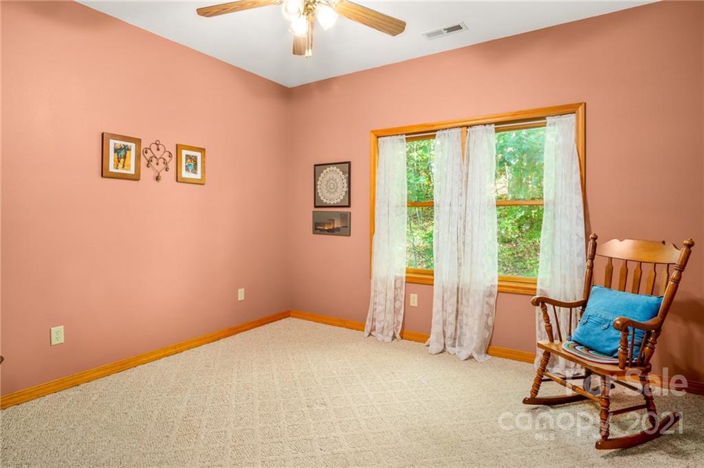 74 Apgar Road Candler, NC 28715 - Photo 20 of 46 a view of a room with furniture and a large window