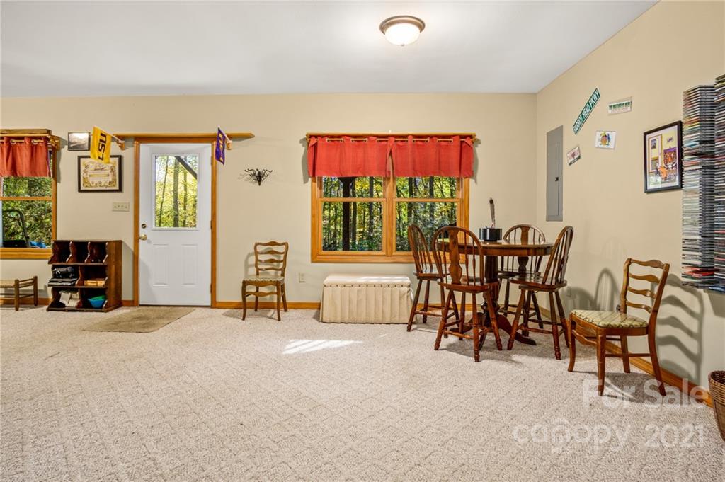 74 Apgar Road Candler, NC 28715 - Photo 29 of 46 a living room with furniture and a flat screen tv