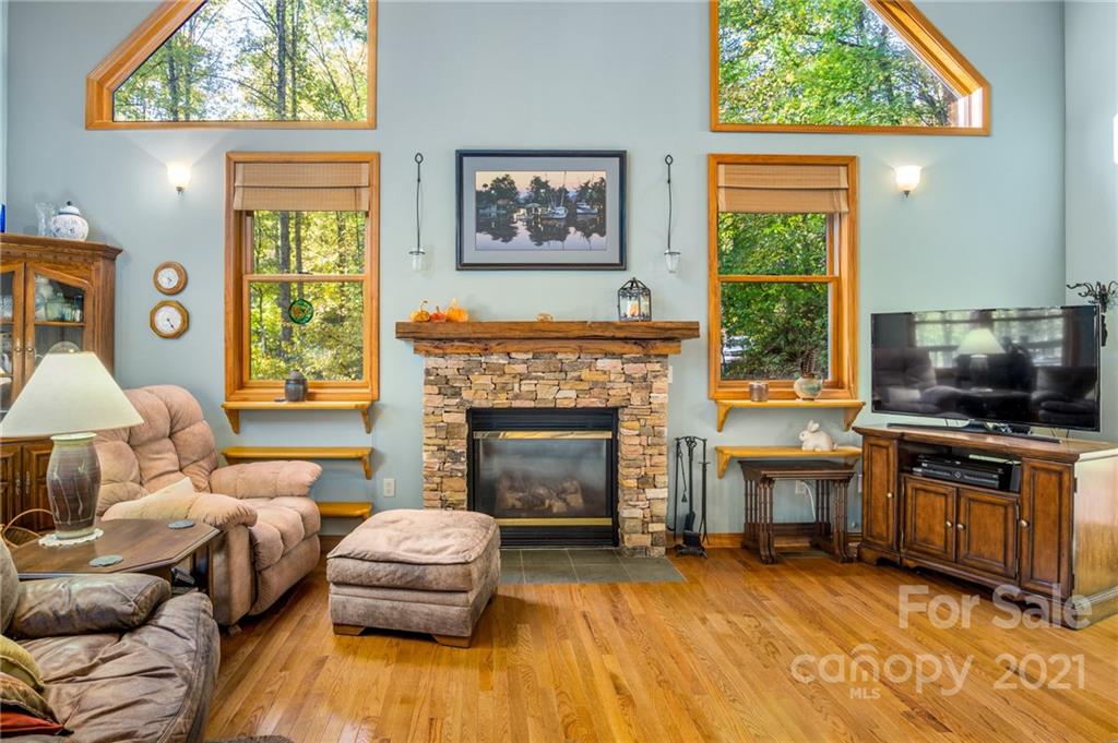 74 Apgar Road Candler, NC 28715 - Photo 4 of 46 a living room with furniture and a fireplace