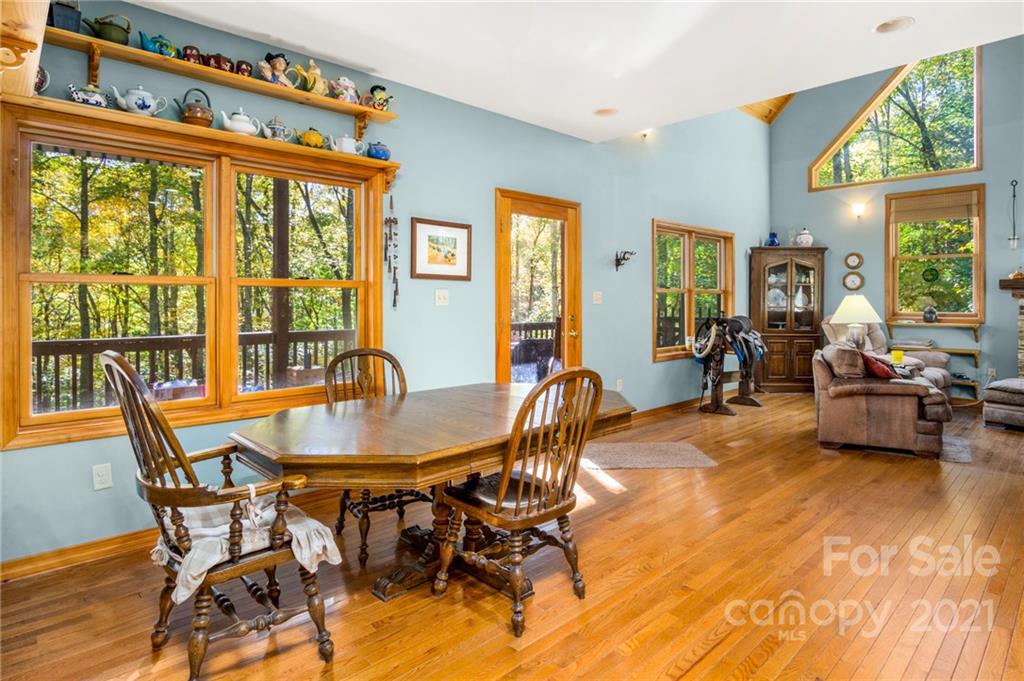74 Apgar Road Candler, NC 28715 - Photo 6 of 46 a view of a dining room with furniture window and wooden floor
