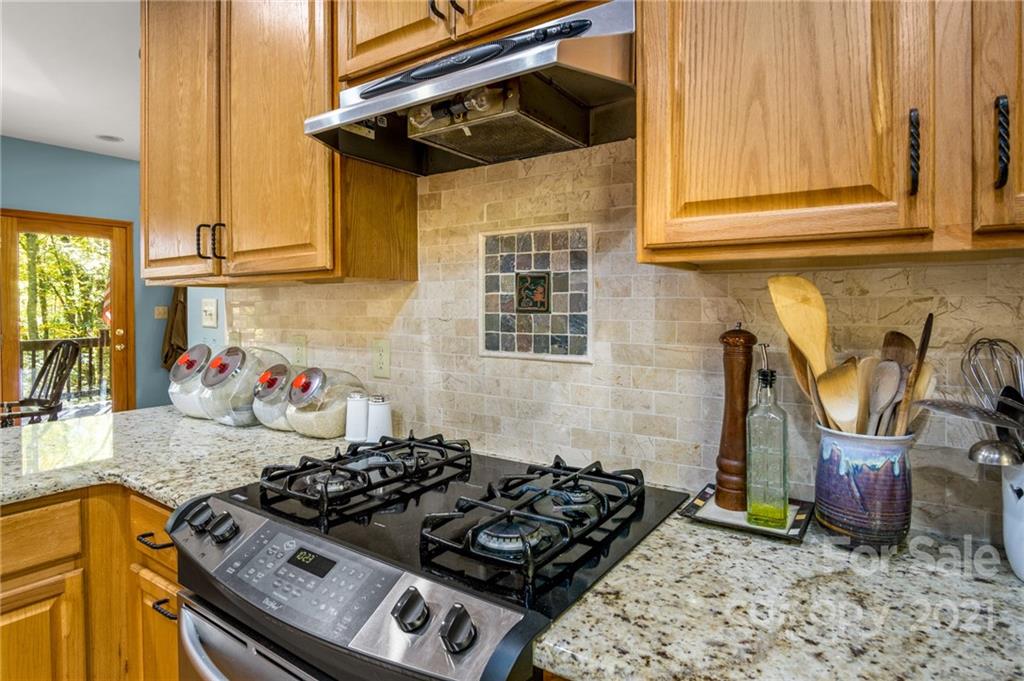 74 Apgar Road Candler, NC 28715 - Photo 10 of 46 a kitchen with a stove and a sink