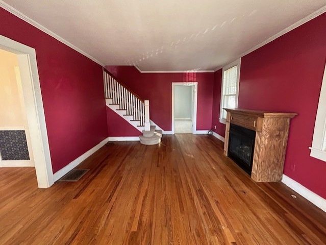 a view of a livingroom with wooden floor