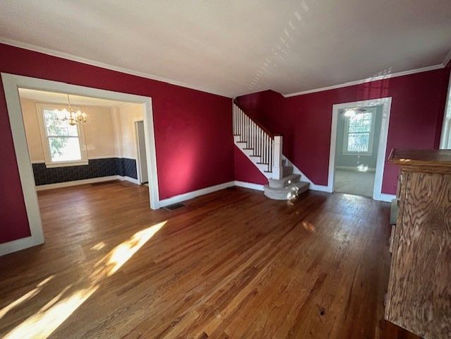 a spacious bedroom with a bed and a dresser