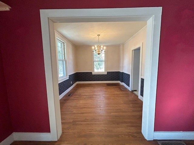 a kitchen with granite countertop a sink and a stove top oven