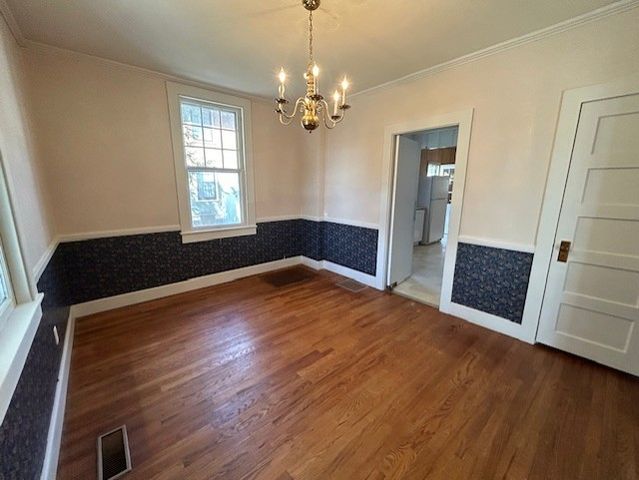 a room with a sink a washer and dryer