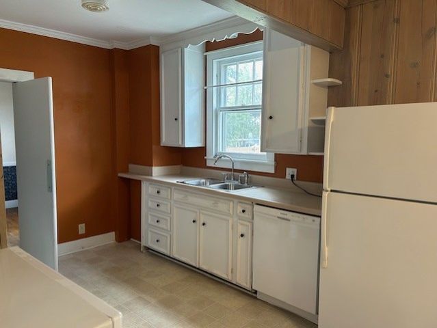 a view of a dining room with furniture and window