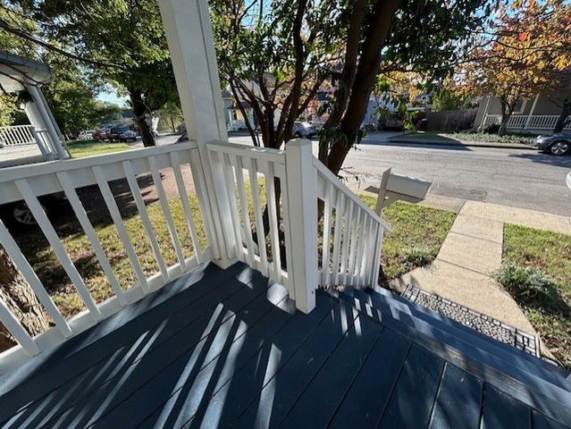 a view of wooden floor and a window in the house