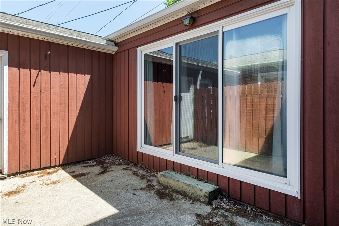 6484 State Road Parma, OH 44134 - Photo 6 of 36 The sliding glass door off the family room opens to a private outdoor patio.