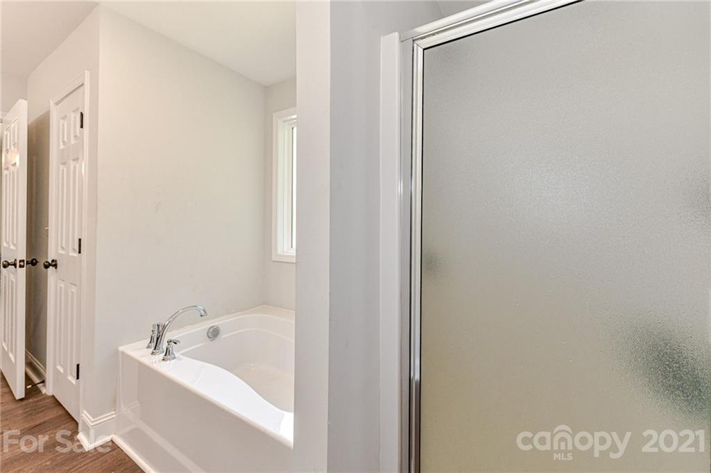 8267 Smith Road Stanfield, NC 28163 - Photo 22 of 40 a bathroom with a bathtub