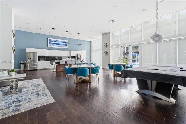 a living room with lots of furniture and wooden floor