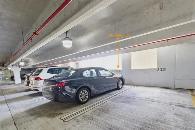 a view of a hallway with wooden staircase