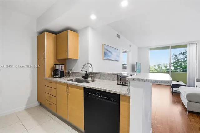 a room with two bed and a window