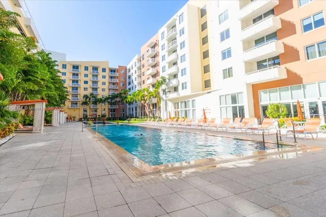 a view of pool with outdoor seating