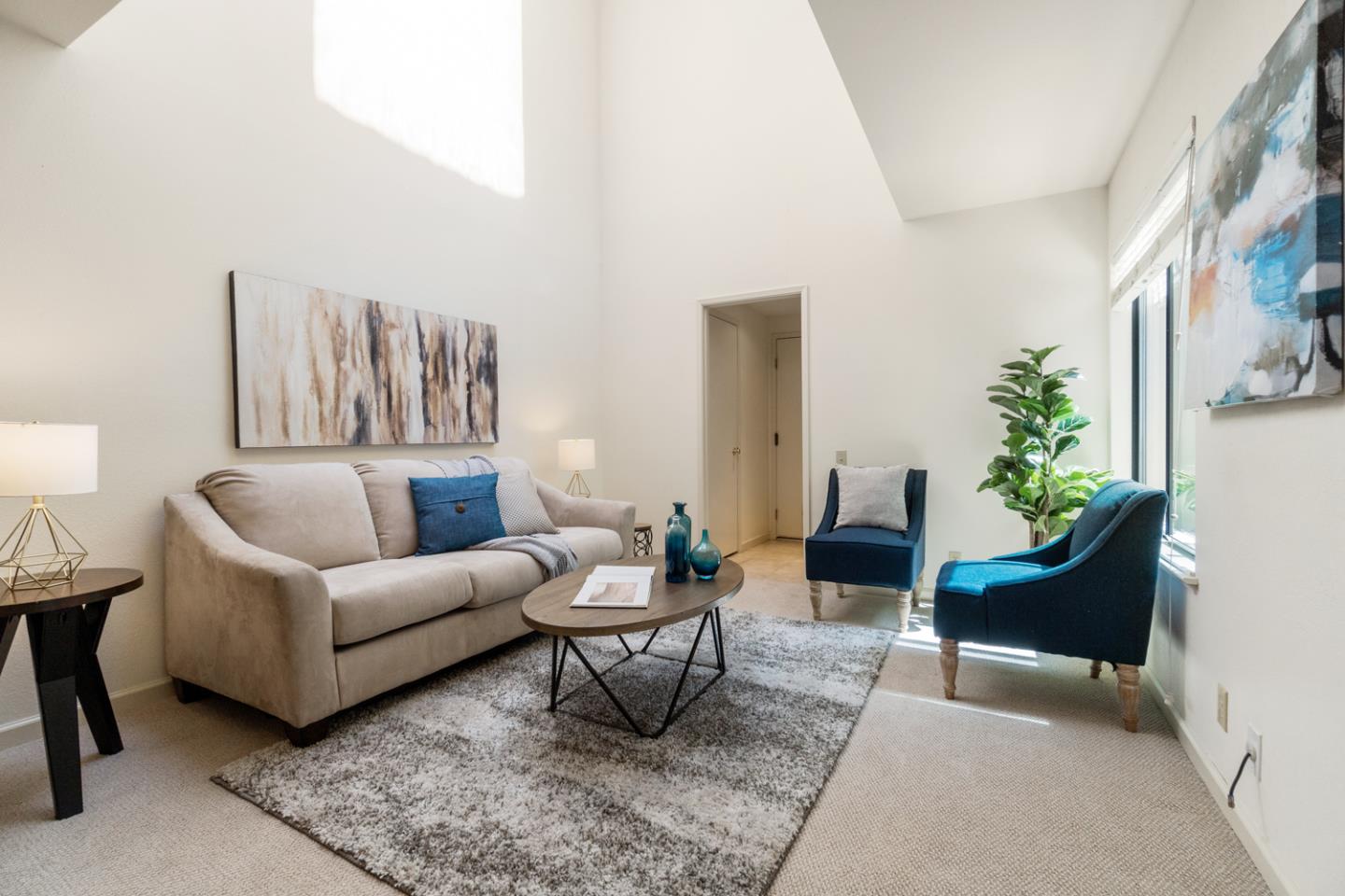 910 Wharfside Road San Mateo, CA 94404 - Photo 15 of 43 a living room with furniture and a potted plant