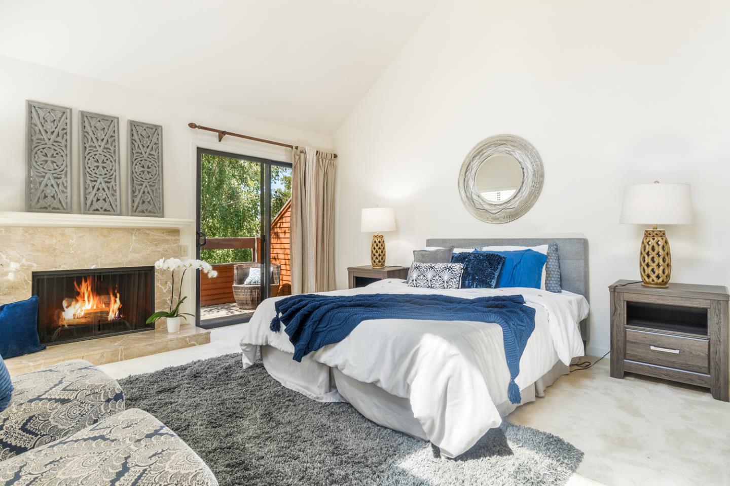 910 Wharfside Road San Mateo, CA 94404 - Photo 18 of 43 a bed room with a bed and a fireplace