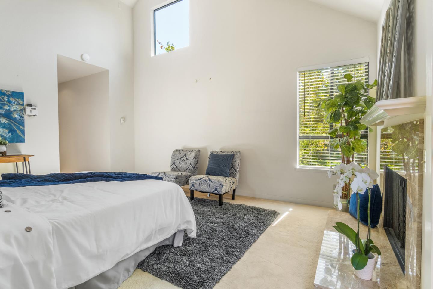 910 Wharfside Road San Mateo, CA 94404 - Photo 20 of 43 a bed sitting in a bedroom next to a window