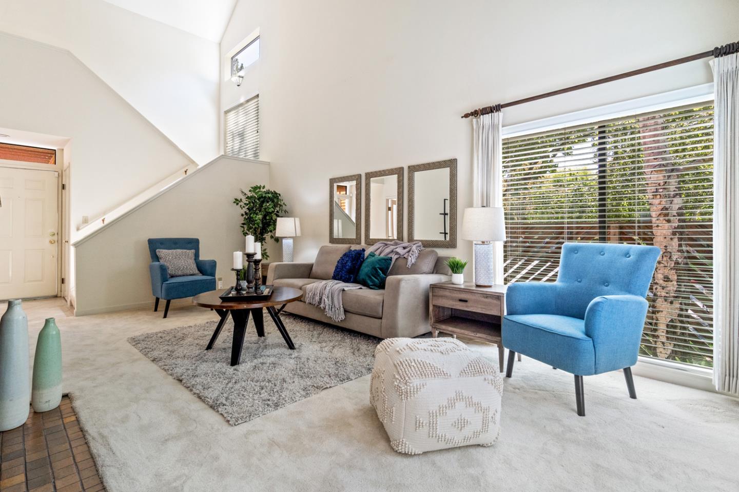 910 Wharfside Road San Mateo, CA 94404 - Photo 2 of 43 a living room with furniture and a large window