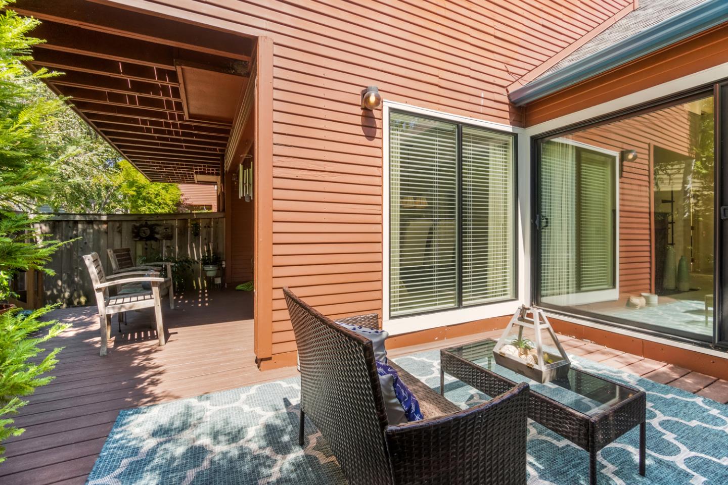 910 Wharfside Road San Mateo, CA 94404 - Photo 35 of 43 a balcony with furniture and a potted plant