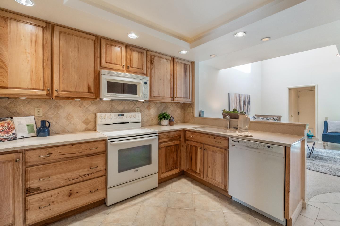 910 Wharfside Road San Mateo, CA 94404 - Photo 8 of 43 a kitchen with a sink stove and microwave