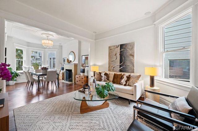 a dining room with furniture and a fireplace