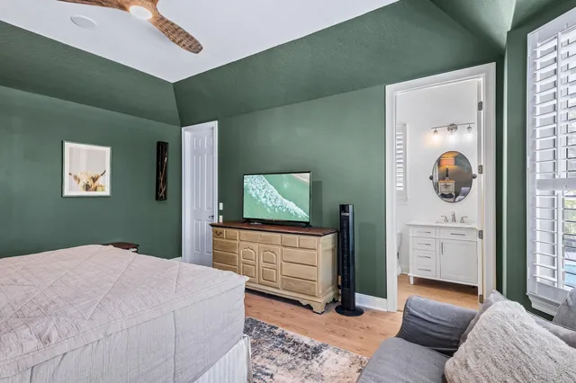 an aerial view of a house with garden space and street view