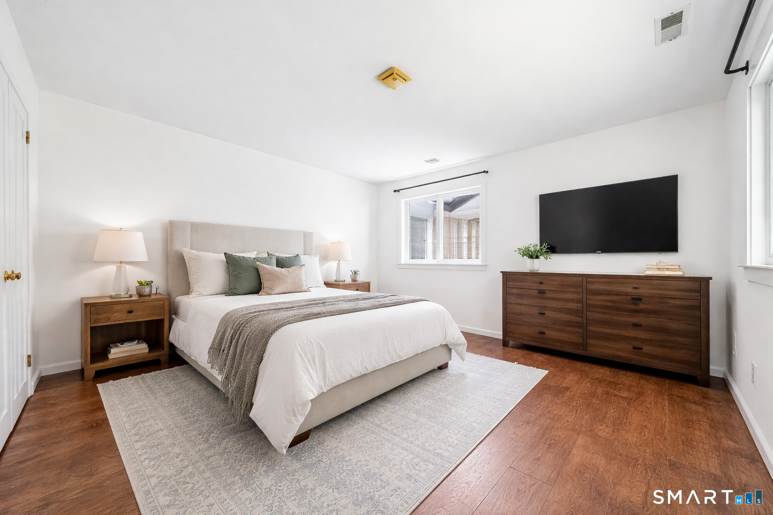 14 Ferris Avenue, Unit 9 Norwalk, CT 06854 - Photo 11 of 20 a bedroom with a bed and a flat screen tv