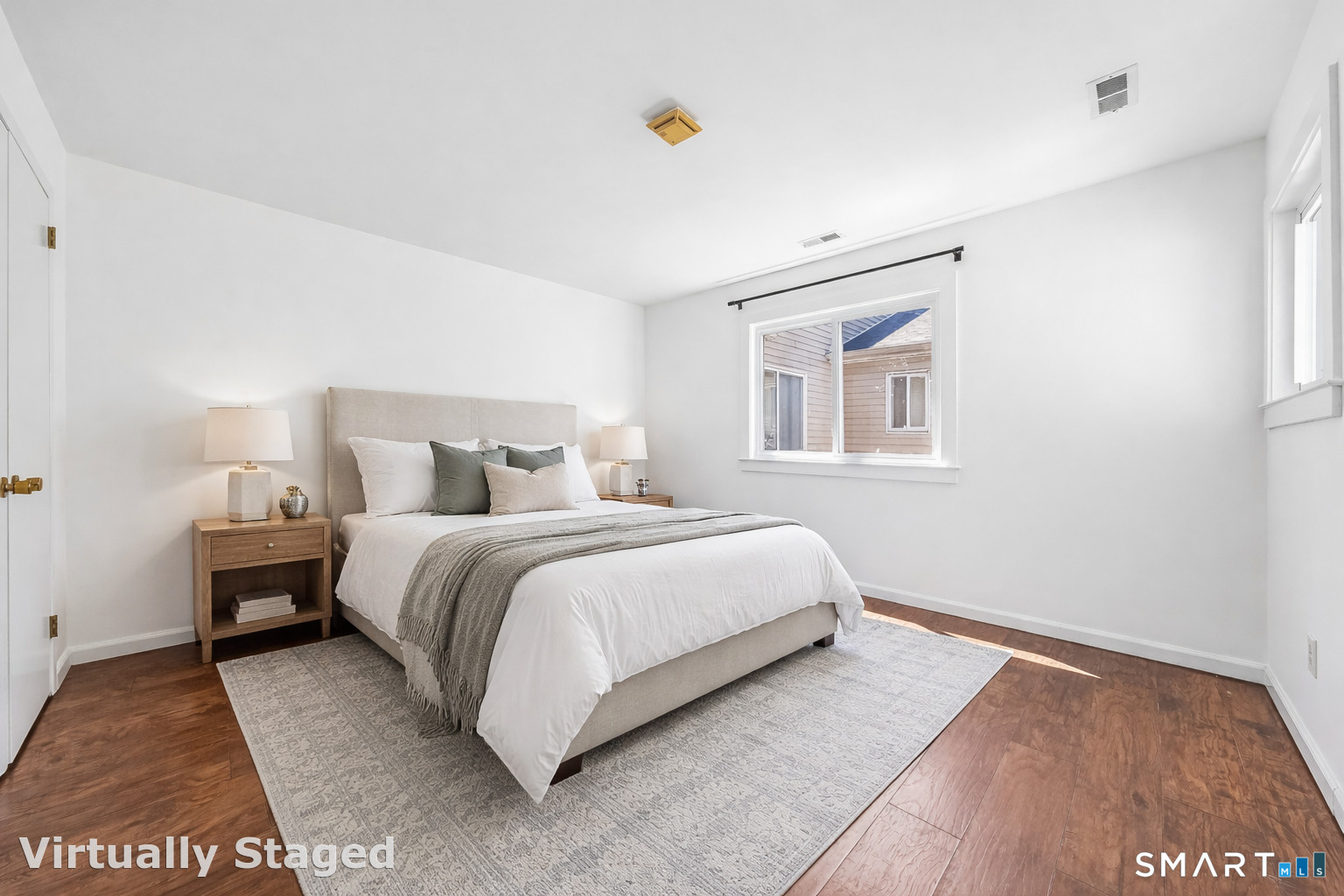 14 Ferris Avenue, Unit 9 Norwalk, CT 06854 - Photo 14 of 20 a bedroom with a bed and a night stand