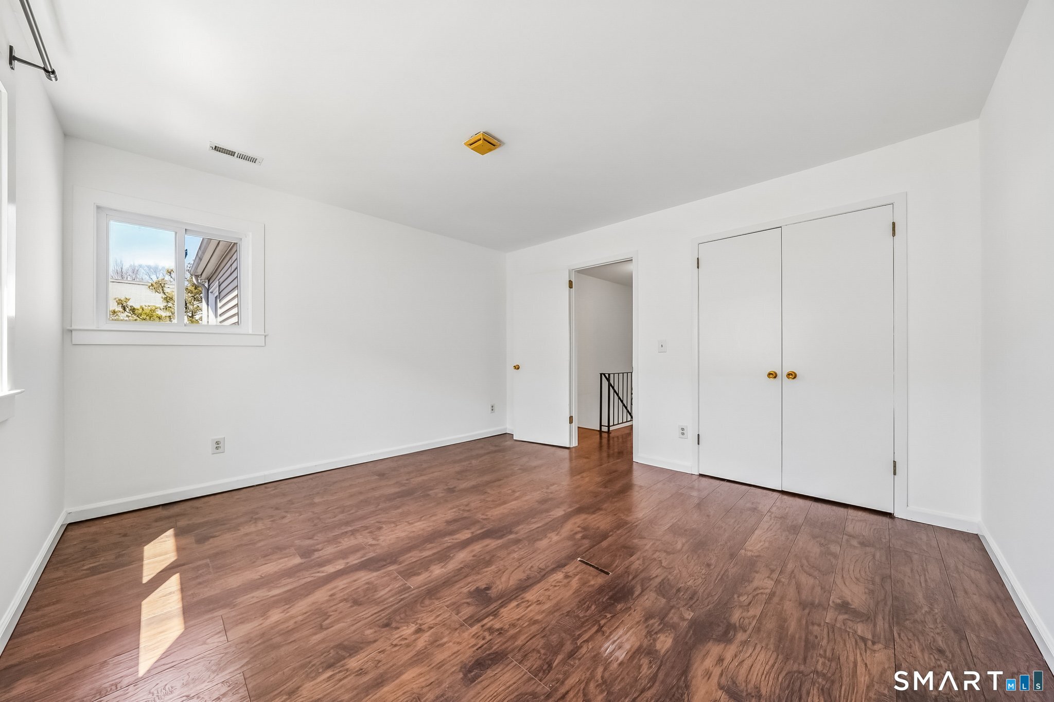 14 Ferris Avenue, Unit 9 Norwalk, CT 06854 - Photo 15 of 20 a view of an empty room with wooden floor