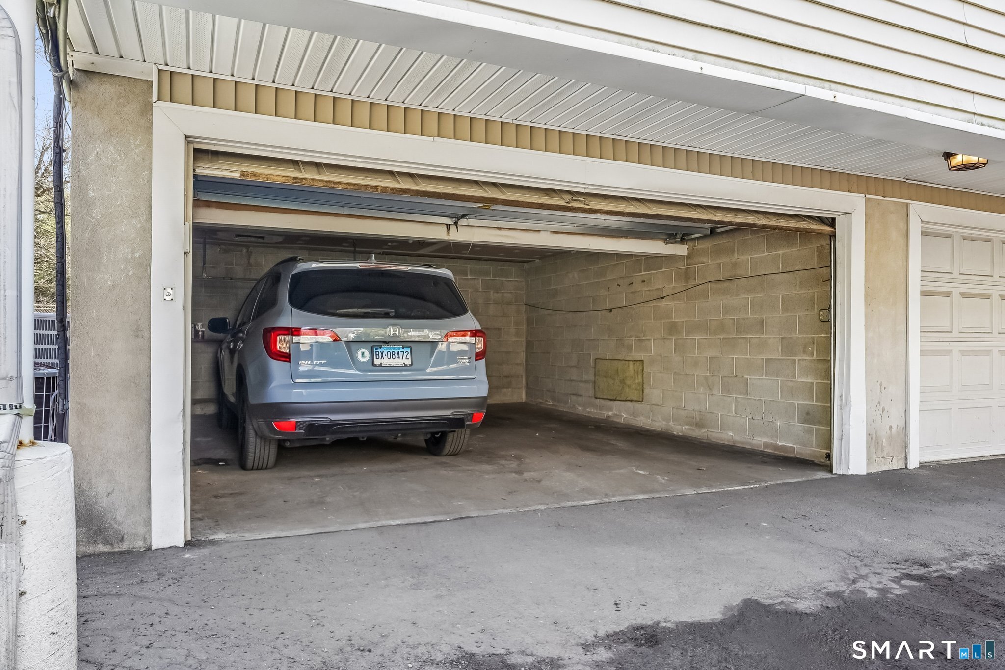 14 Ferris Avenue, Unit 9 Norwalk, CT 06854 - Photo 16 of 20 a view of car parked in garage