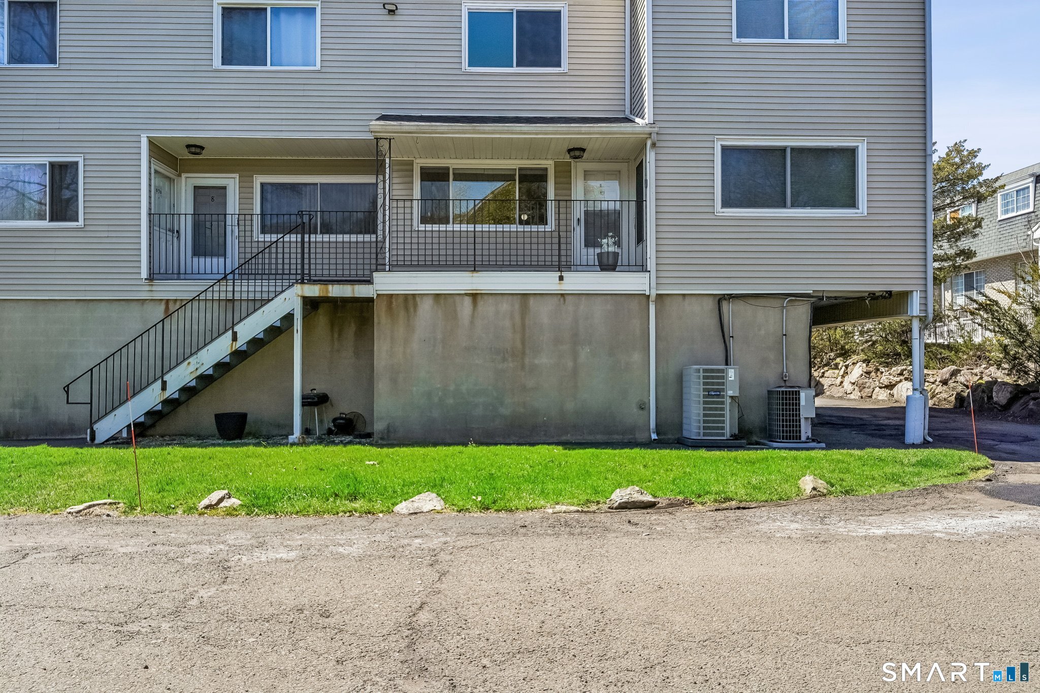 14 Ferris Avenue, Unit 9 Norwalk, CT 06854 - Photo 18 of 20 a view of a brick house with a yard and a large window