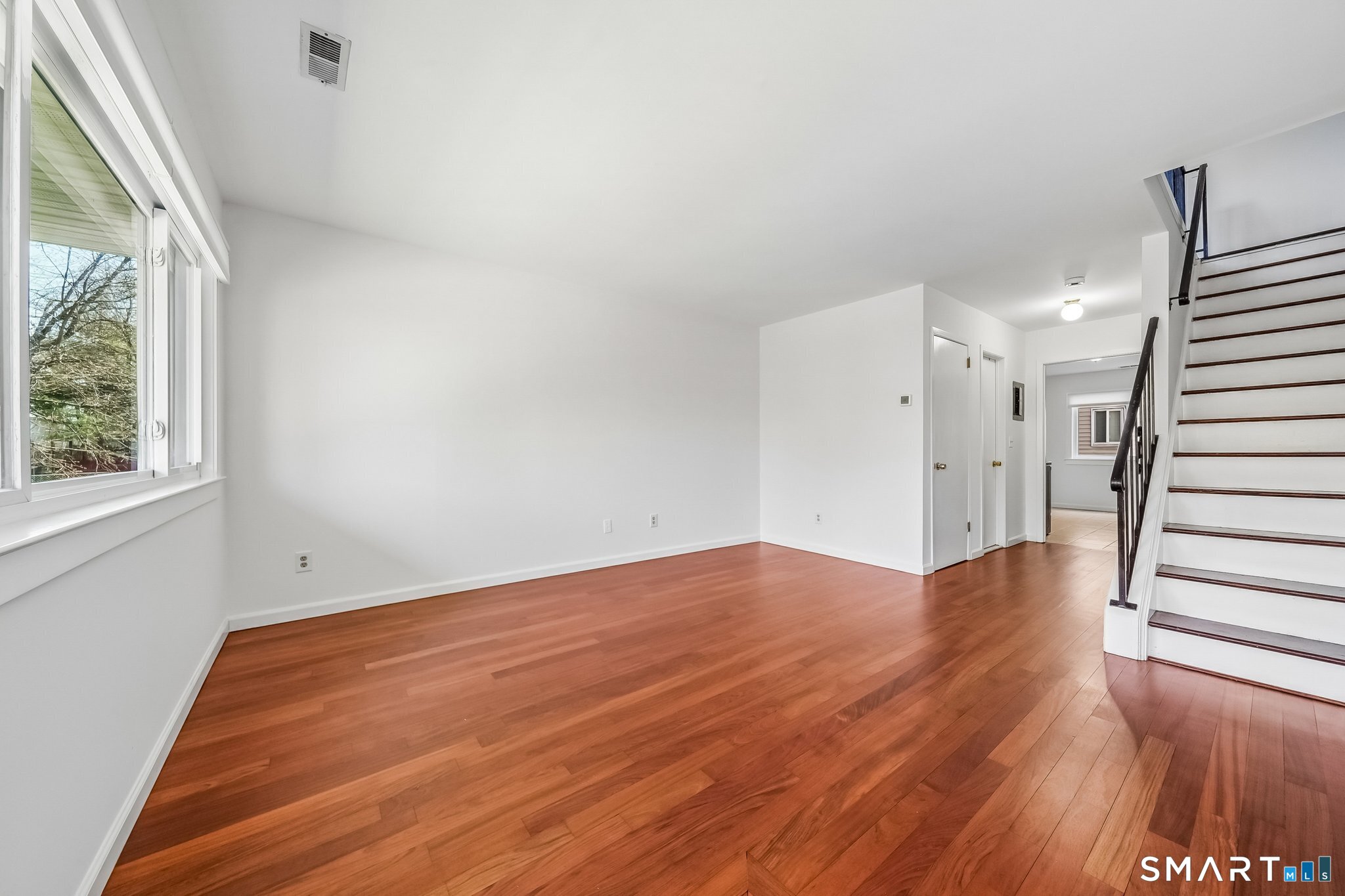 14 Ferris Avenue, Unit 9 Norwalk, CT 06854 - Photo 2 of 20 a view of empty room with wooden floor and fan