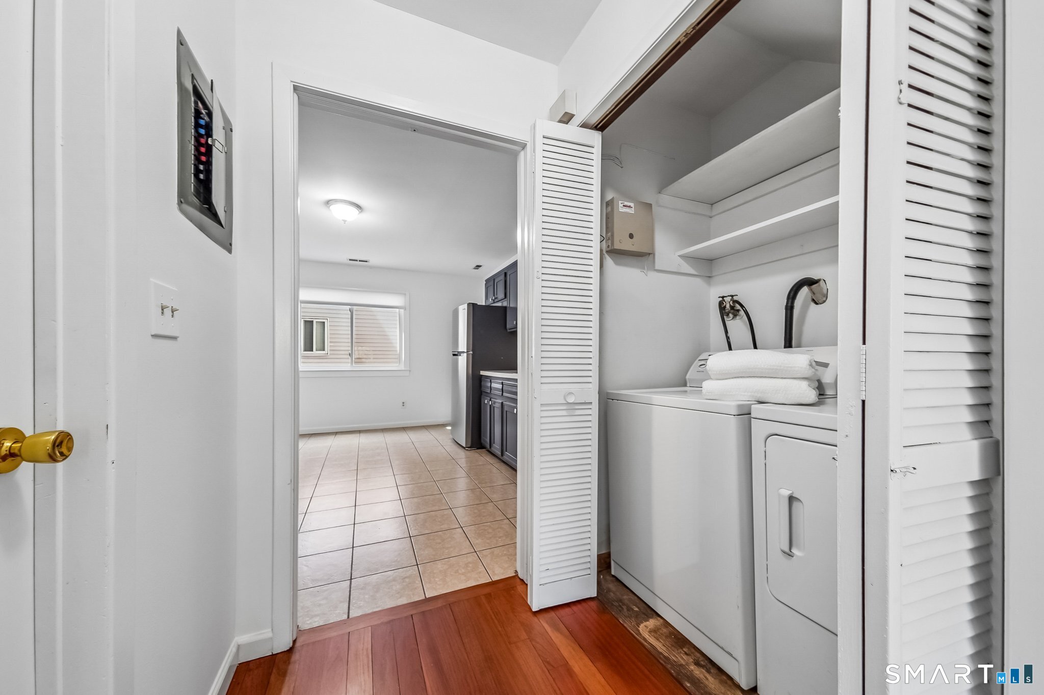 14 Ferris Avenue, Unit 9 Norwalk, CT 06854 - Photo 7 of 20 a view of a hallway with washer and dryer