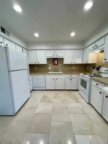a bathroom with a sink mirror and toilet