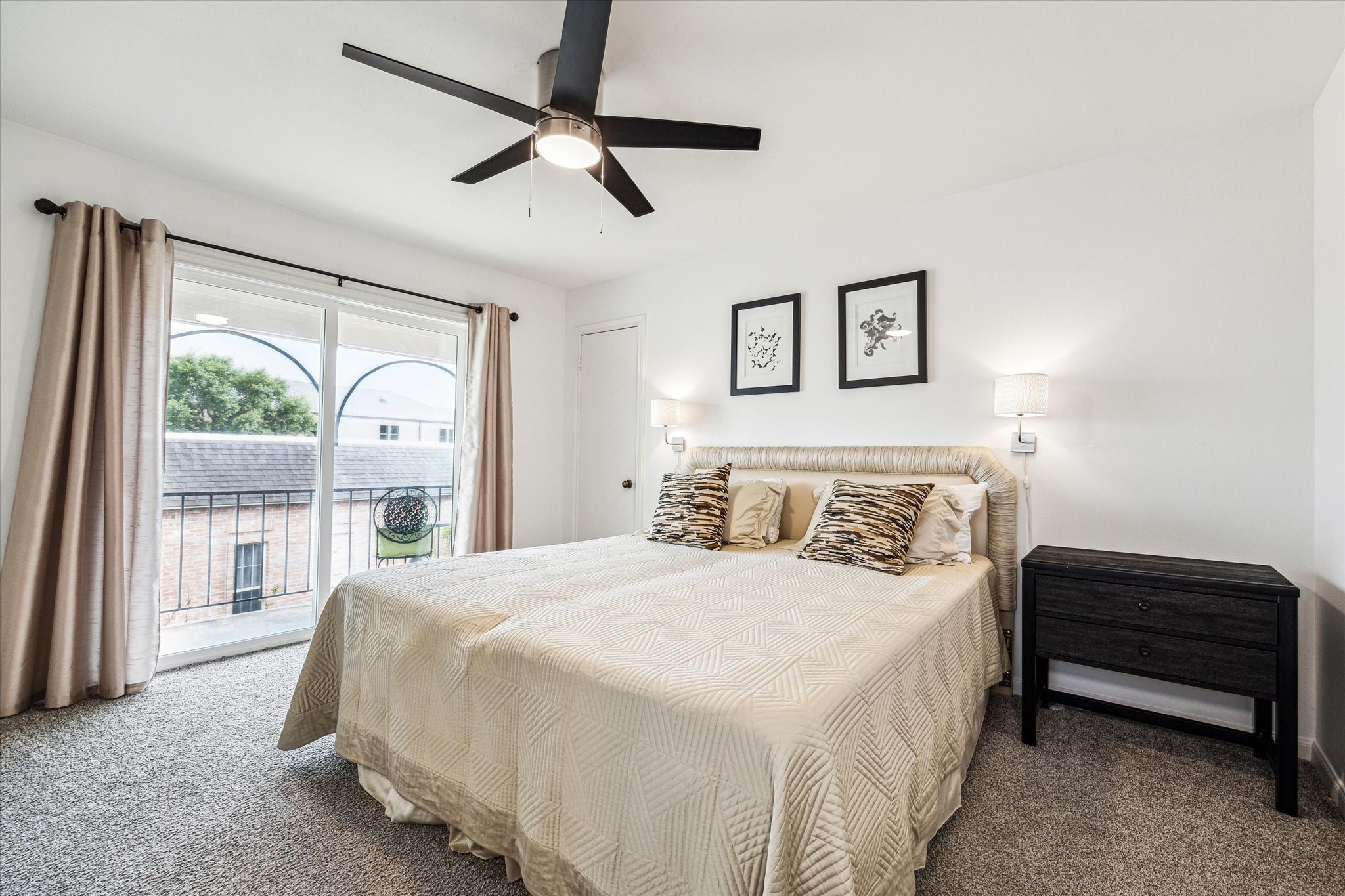 1880 Saxony Lane Houston, TX 77058 - Photo 18 of 38 a bedroom with a large bed and a large window