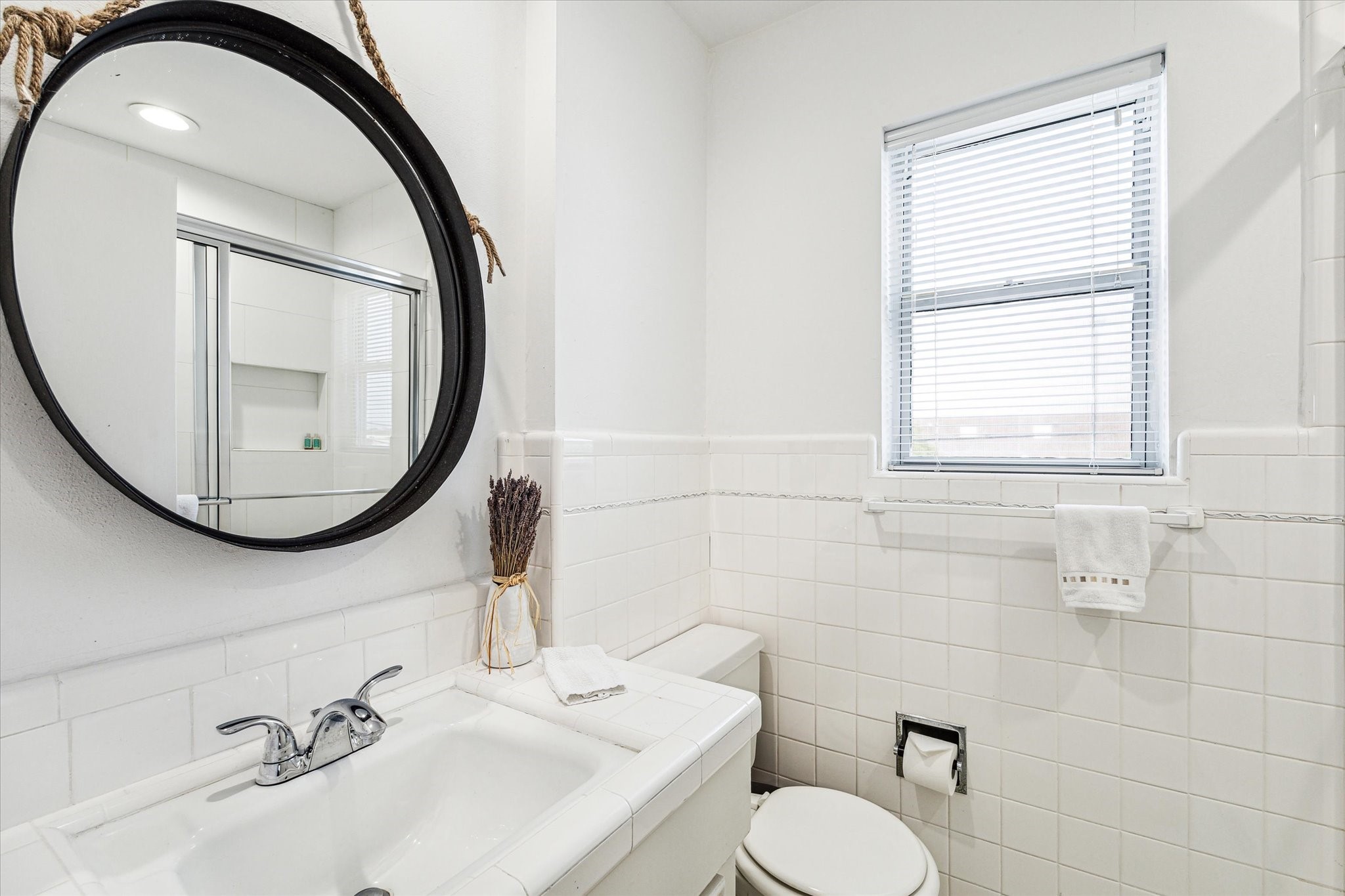 1880 Saxony Lane Houston, TX 77058 - Photo 19 of 38 a bathroom with a sink mirror and toilet
