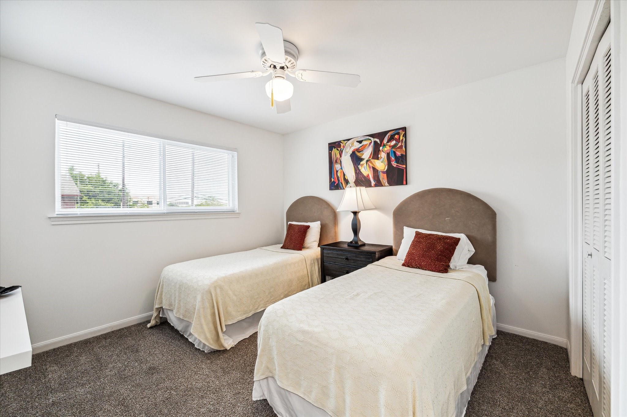 1880 Saxony Lane Houston, TX 77058 - Photo 20 of 38 a bedroom with two beds and a window
