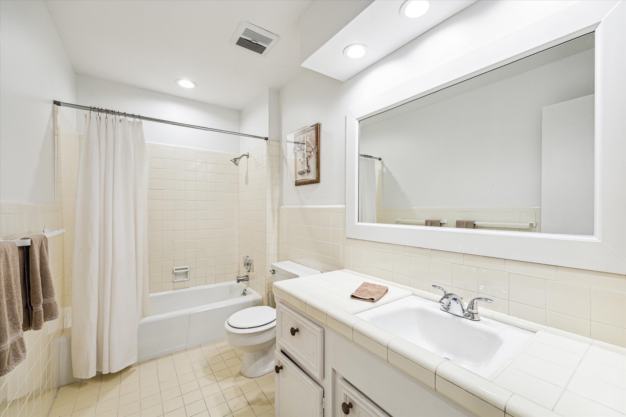 1880 Saxony Lane Houston, TX 77058 - Photo 22 of 38 a bathroom with a sink toilet a shower and a mirror