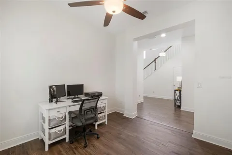 a spacious bedroom with a bed and a large window