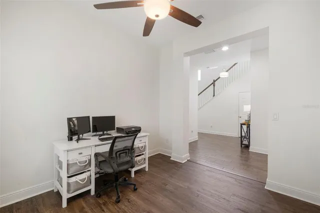 a spacious bedroom with a bed and a large window